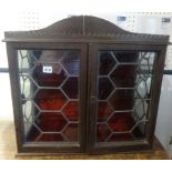 A small table top two door glazed oak cabinet, also a turned wood standard lamp (2)