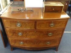 An early Victorian mahogany chest of drawers, fitted with two short and two longs drawers on splayed