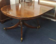 A good quality mahogany large twin pedestal dining table of Georgian design, the top crossbanded and