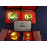 Swarovski Crystal Glass. Collection of Four Crystal Paperweights of different sizes, with Yellow