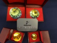 Swarovski Crystal Glass. Collection of Four Crystal Paperweights of different sizes, with Yellow