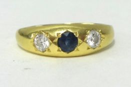 A 9ct sapphire and diamond 3 stone ring.