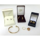 A 9ct gold three colour bangle, pair white gold modern earrings, gold locket, pair drop earrings,