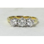 A modern three stone diamond set ring, approx 0.75 carats, finger size M, (with original receipt).