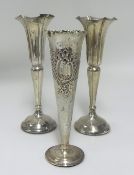 A pair Geo V silver spill vases, height 20cm and another (3)