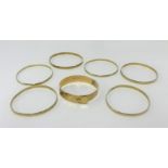 Six 9ct gold bangles, approx 58.50gms.