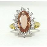 An 18ct diamond and topaz cluster ring, approx 16mm x 12mm, finger size M.