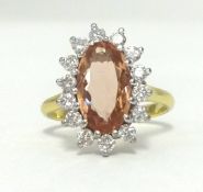 An 18ct diamond and topaz cluster ring, approx 16mm x 12mm, finger size M.