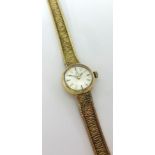 Omega, a ladies 9ct gold wristwatch with 9ct gold bracelet stamped '375', approx 15gms.