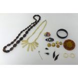 Carved bone necklace, various brooches, tie pin, gilt buttons and other items.