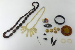 Carved bone necklace, various brooches, tie pin, gilt buttons and other items.