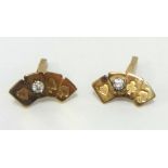 A pair 9ct gold cufflinks, modelled as a set of bridge cards set with a diamond, approx 6.90gms.