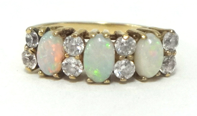 A 9ct opal and diamond ring, finger size K