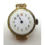 A traditional ladies 9ct gold wrist watch with a yellow metal gate bracelet
