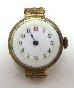 A traditional ladies 9ct gold wrist watch with a yellow metal gate bracelet