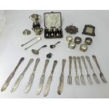 Various items including silver ring stand, two ornate silver napkin rings and three others (4oz),