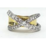 A large and impressive 18ct diamond cross over band ring, finger size S.