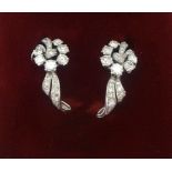 Garrard, London, a pretty pair of diamond set dress clips.