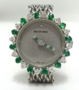 Bueche Girod, a ladies white gold diamond and emerald set Swiss cocktail wristwatch.
