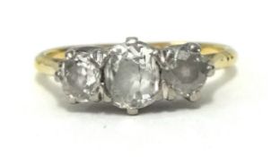 An 18ct diamond set three stone ring, finger size N.