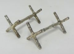 A pair silver knife rests, approx 3.18oz.