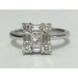 An 18ct white gold diamond ring, of square form set with an arrangement of round and baguette cut