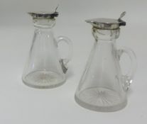 Asprey & Co, a pair Geo V glass and silver whisky tots, height 10cm.