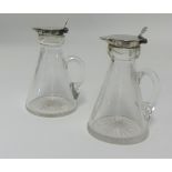 Asprey & Co, a pair Geo V glass and silver whisky tots, height 10cm.