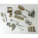 A three piece silver back dressing table set, pair silver napkin rings, general coins, cufflinks,