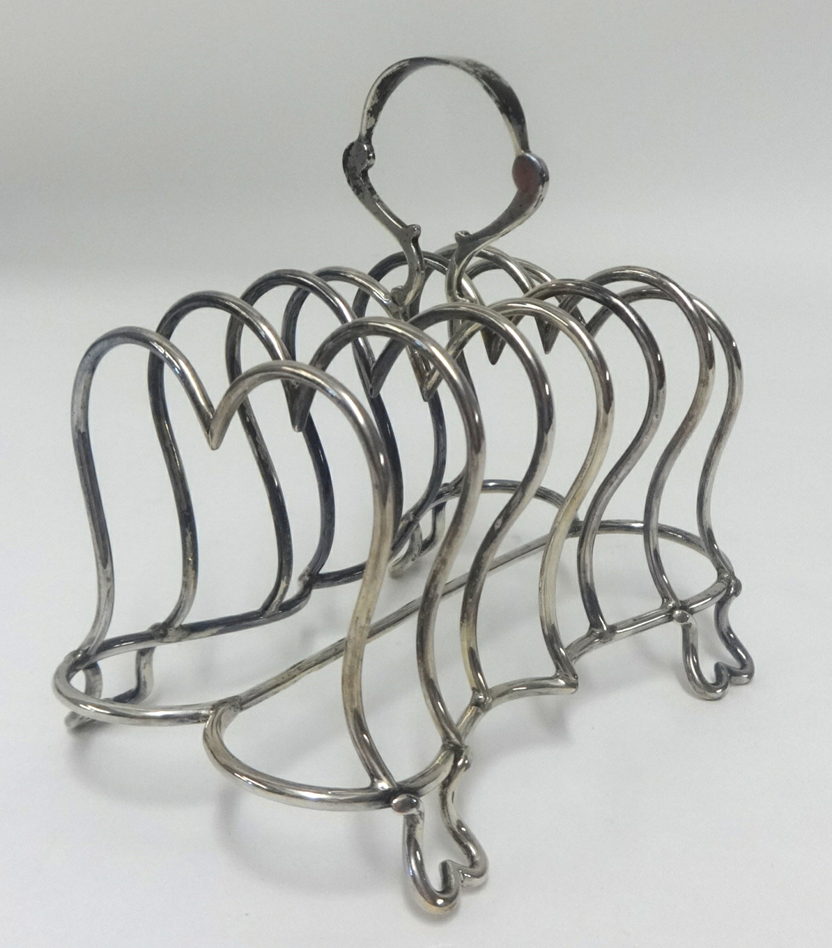 An Edwardian silver six division toast rack, approx 6.89oz.