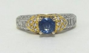 An 18ct diamond and sapphire ring, finger size O