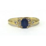 A sapphire and diamond ring, stamped 585, finger size Q.