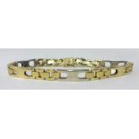 A 14ct yellow and white gold bracelet, approx 20gms.