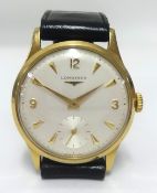Longines, a gents 9ct gold traditional wristwatch with sub second dial.