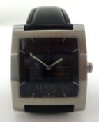 Dunhill, a gents DM7 stainless steel Analog/Digital wristwatch, with original box.