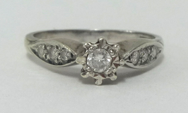 A small diamond set ring, white metal, approx .25 carats, finger size N.
