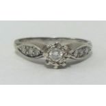 A small diamond set ring, white metal, approx .25 carats, finger size N.
