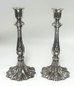 A pair of white metal candlesticks, height 27cm.