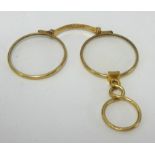 A pair 18ct gold folding spectacles, stamped 'Carpenter & Wesley, 24 Regent Street, London',
