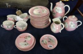 A 19th/20th century Japanese porcelain pink set, decorated on a pink ground.