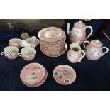 A 19th/20th century Japanese porcelain pink set, decorated on a pink ground.