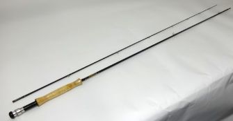 Hardy , a Graphite Fishing Rod, two piece, with cloth bag.