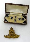 A cased set of cufflinks and tie clips in white metal and black onyx also a cased Royal Artillery