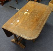 A carved hardwood commode and a carved oak drop flap table (2).
