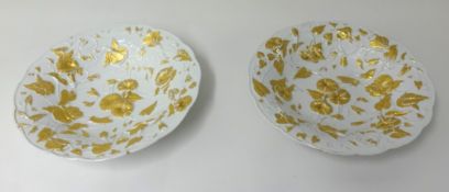 A pair of porcelain gilt bowls, possibly Meissen with underglaze blue cross swords mark.