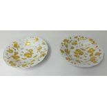 A pair of porcelain gilt bowls, possibly Meissen with underglaze blue cross swords mark.