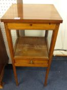 A small mahogany table cabinet.