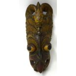 An large carved wood 'Tibetan Devils Mask' (in three parts)