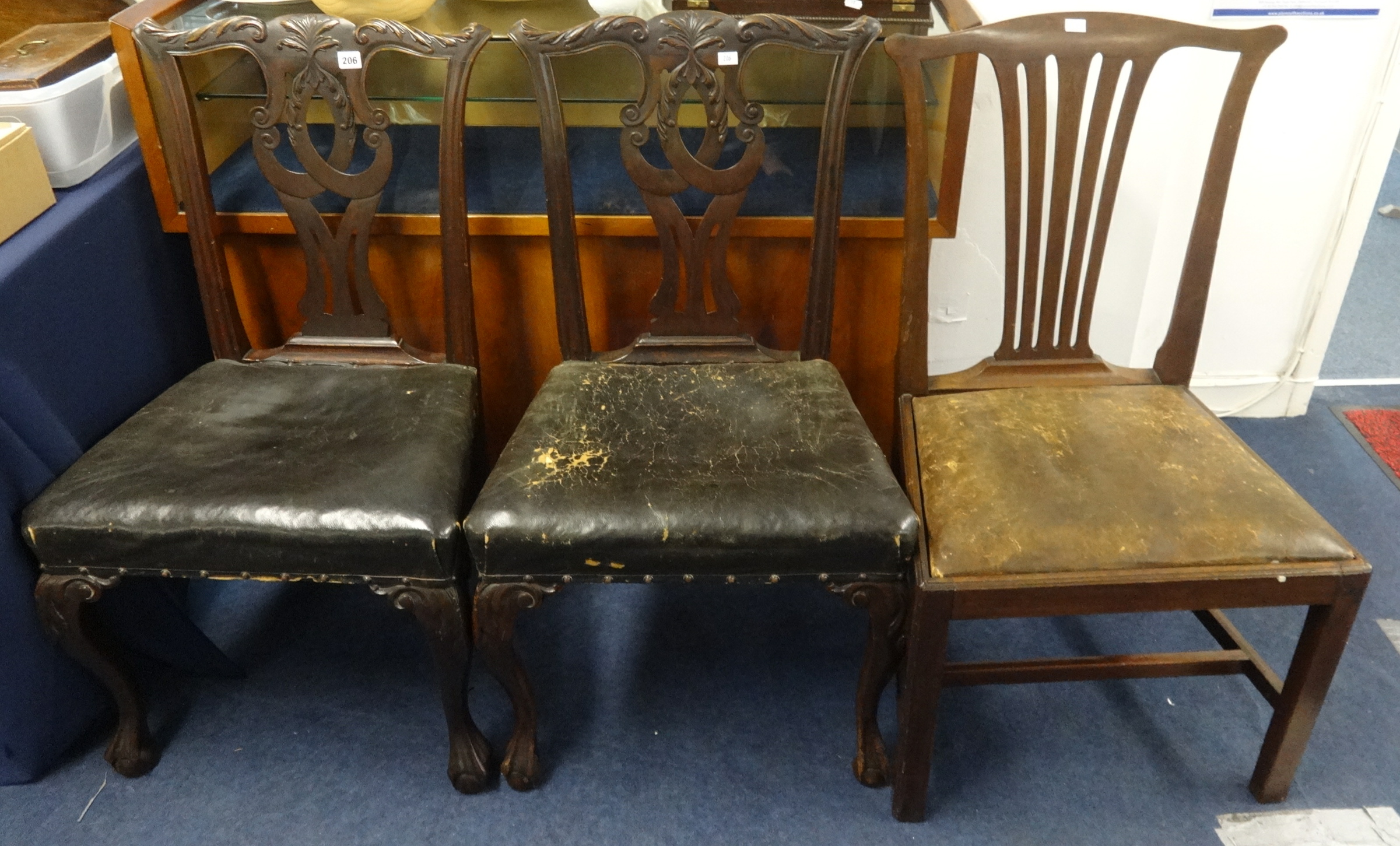 A pair of carved mahogany side chairs of Georgian design and another (3)
