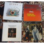 Collection of vinyl records (albums) by Queen including 'The Show must go on', 'Return of the